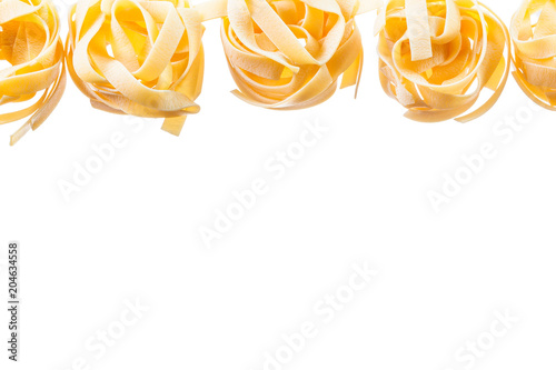 Rolled raw pasta isolated on white