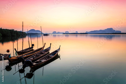 Wooden boat in the sea at sunrise in Phuket,Thailand.
