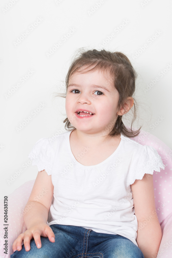 Portrait of a happy laughing child girl on white Portrait of a happy laughing child girl on white