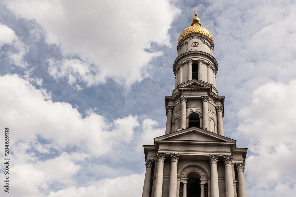 Blue sky with cloud. Yellow dome. Uspenskiy Sobor Located in the Kharkov Ukraine April 2018 Blue sky with cloud. Yellow dome. Uspenskiy Sobor Located in the Kharkov Ukraine April 2018