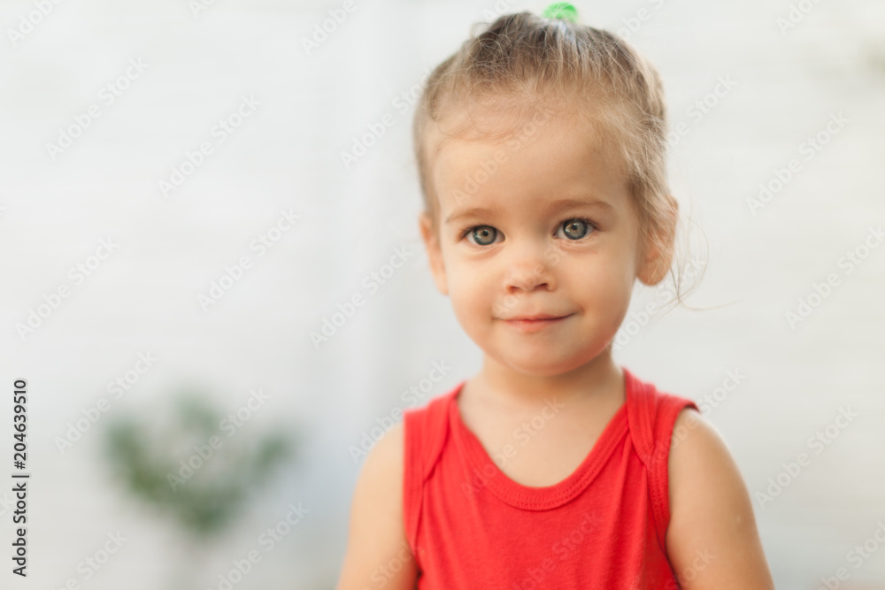Portrait of blonde girl with blue eyes in the park. Child, baby girl close up smile Portrait of blonde girl with blue eyes in the park. Child, baby girl close up smile