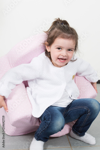 funny Happy little child girl isolated on white background