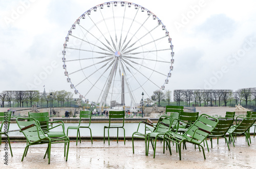 Photography Empty chairs at the Tuileries Garden on a rainy day in Paris, France