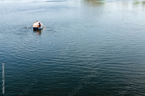 Tranquil view of a couple on a rowing boat in a lake