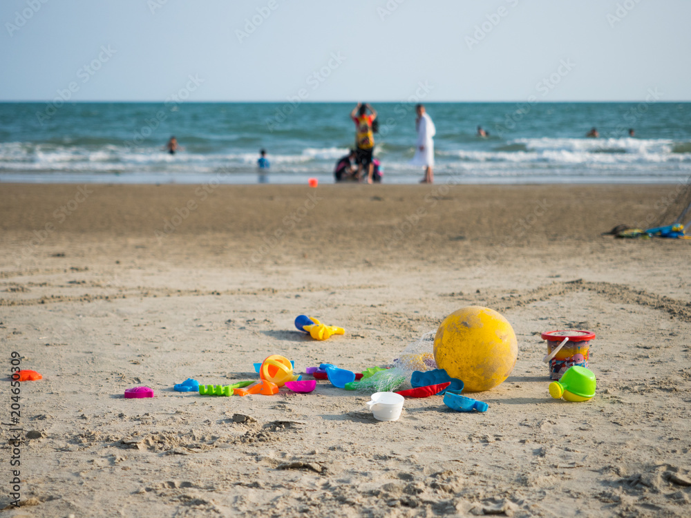 Baby beach toys on the beach with sea in the background, Thailand beach Baby beach toys on the beach with sea in the background, Thailand beach