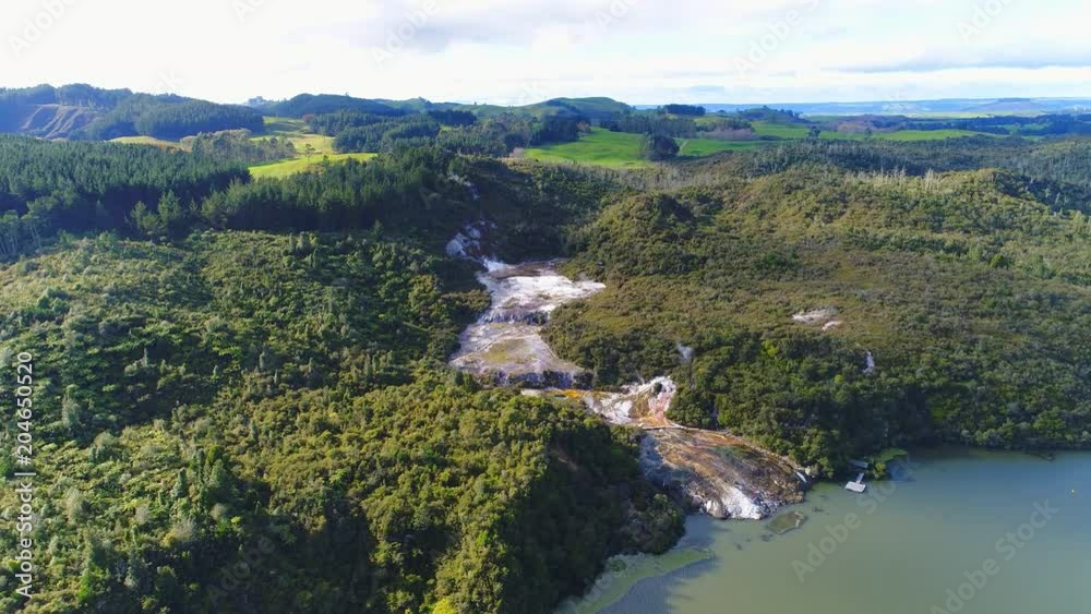 Aerial view of Orakei Korako Geothermal Park (The Hidden Valley), smoke and steam from thermal springs and geysers - North Island, New Zealand from above, 4k UHD Aerial view of Orakei Korako Geothermal Park (The Hidden Valley), smoke and steam from thermal springs and geysers - North Island, New Zealand from above, 4k UHD