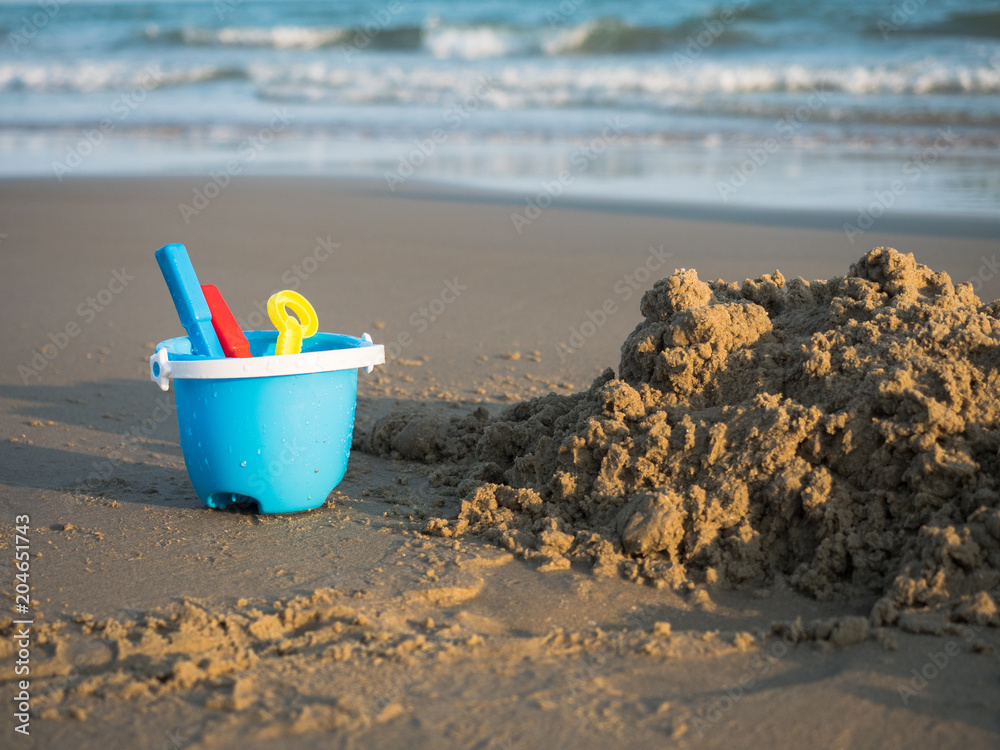 Baby beach toys on the beach with sea in the background, Thailand beach Baby beach toys on the beach with sea in the background, Thailand beach