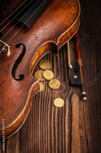 Violin waist detail on rustic wooden background