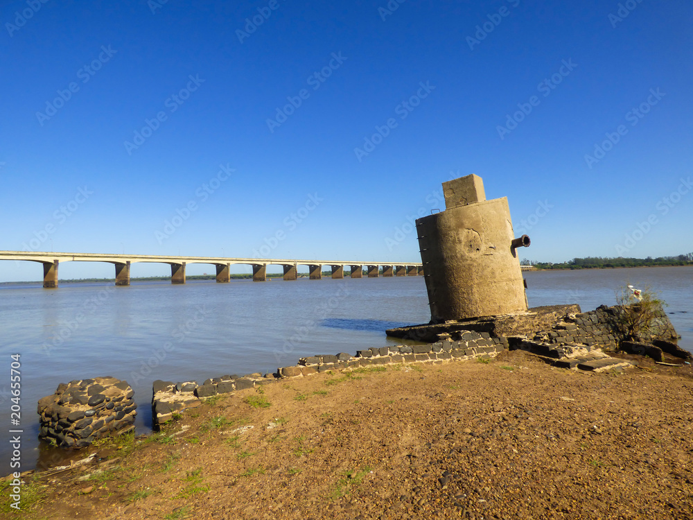 A view of the Uruguay river at the border between Brazil and Argentina, International Bridge in the background (Uruguaiana, Brazil)