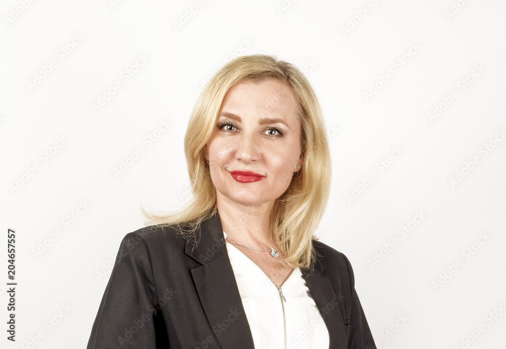 Studio portrait of young attractive businesswoman in shirt and jacket, looking at camera. Studio portrait of young attractive businesswoman in shirt and jacket, looking at camera.