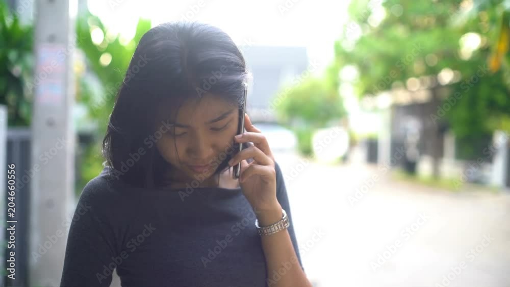Young asian girl talks on phone in townhouse village 4k UHD (3840x2160)
Young asian girl talks on phone in townhouse village 4k UHD (3840x2160)