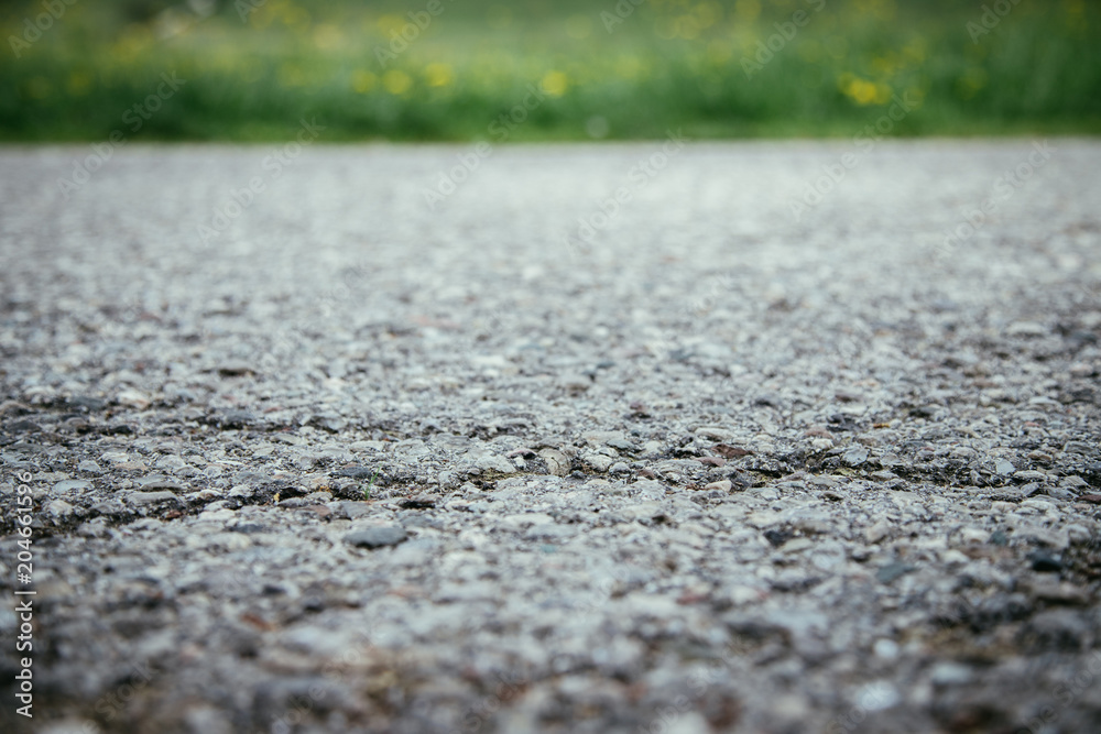 Nahaufnahme Asphalt, unscharfer Hintergrund Nahaufnahme Asphalt, unscharfer Hintergrund