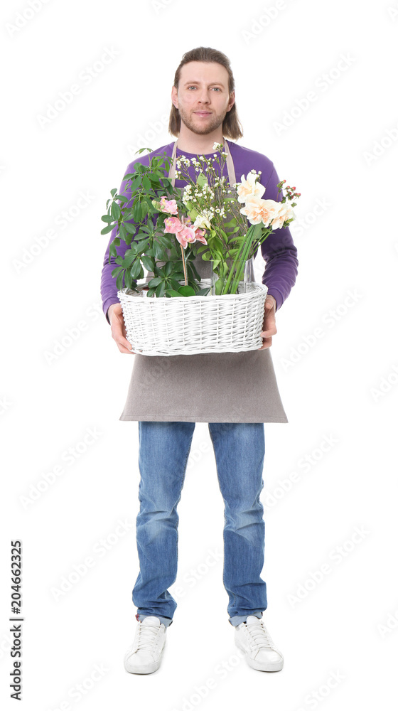 Male florist holding basket with flowers on white background Male florist holding basket with flowers on white background