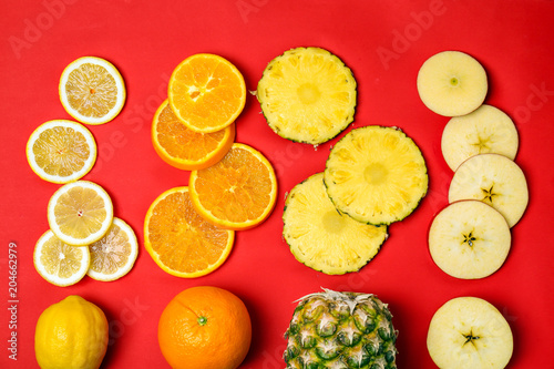 Rainbow composition with fresh fruits on color background, flat lay