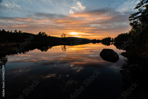 beautiful sunset over a swedish lake photo