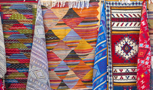 Traditional Moroccan Souvenirs and Carpets at a Market in Medina District