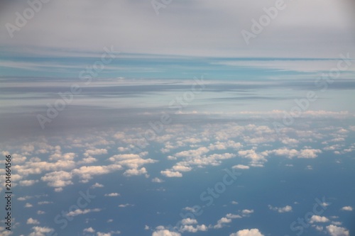 Above White Clouds and the Blue Atlantic Ocean High in the Stratosphere Above 30 000 Feet Traveling North Along the East Coast of the U.S. Toward Virginia 