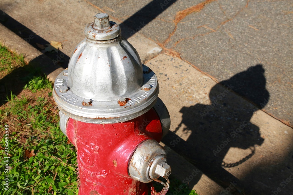 Red Fire Hydrant Streetside Next to Curb in a Sunny Afternoon in Burke, Virginia Red Fire Hydrant Streetside Next to Curb in a Sunny Afternoon in Burke, Virginia