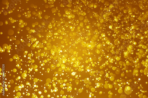 abstract yellow gold bokeh glitter sparkle background.