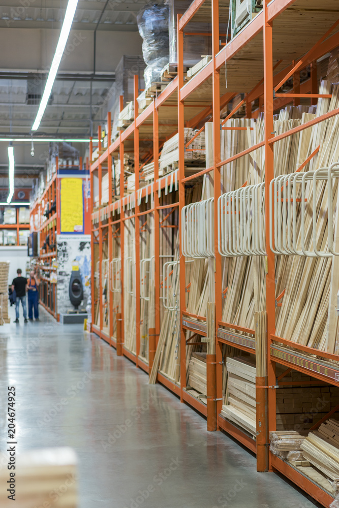 Fototapeta premium interior of hardware retailer with aisles, shelves, racks of building material insulation floor to ceiling