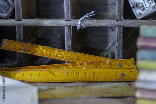 Vintage slide ruler on a vintage background with distressed textures. Great background/backdrop image! 