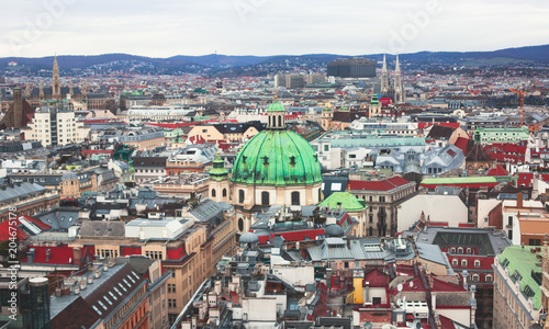 Beautiful super-wide angle aerial view of Vienna, Austria, with old town Historic Center and scenery beyond the city, shot from observation deck of Saint Stephens's Cathedral