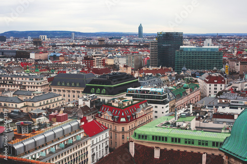 Beautiful super-wide angle aerial view of Vienna, Austria, with old town Historic Center and scenery beyond the city, shot from observation deck of Saint Stephens's Cathedral