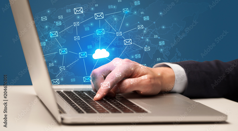 Businessman hand sending a bunch of messages on laptop with cloud computing concept
Businessman hand sending a bunch of messages on laptop with cloud computing concept