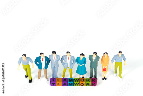 TEAMWORK text and Group of figure miniature businessman or small people investor and office worker secretary on white background for money and financial business teamwork concept.