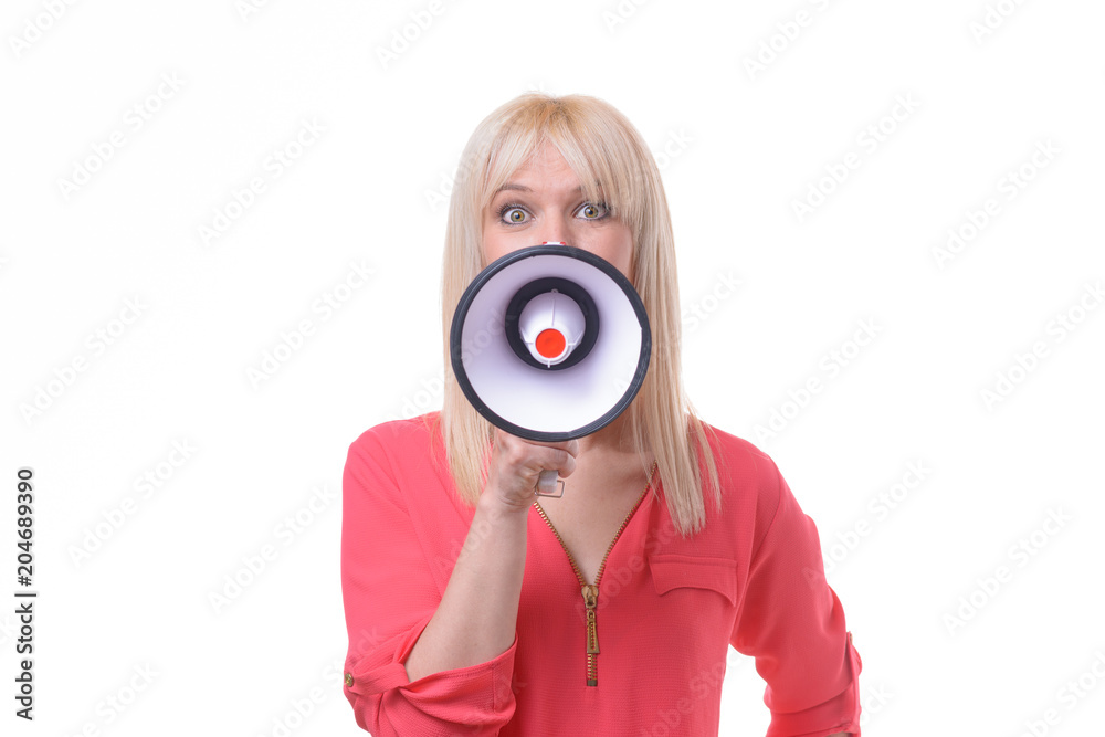 Young blond woman yelling into a megaphone Young blond woman yelling into a megaphone