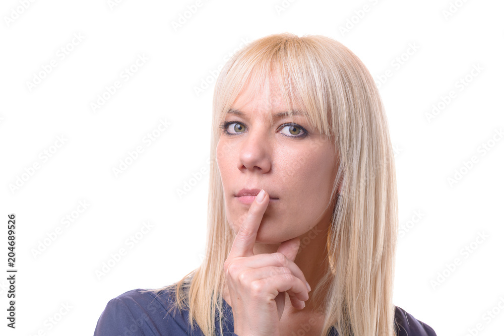 Thoughtful woman with her finger to her lips