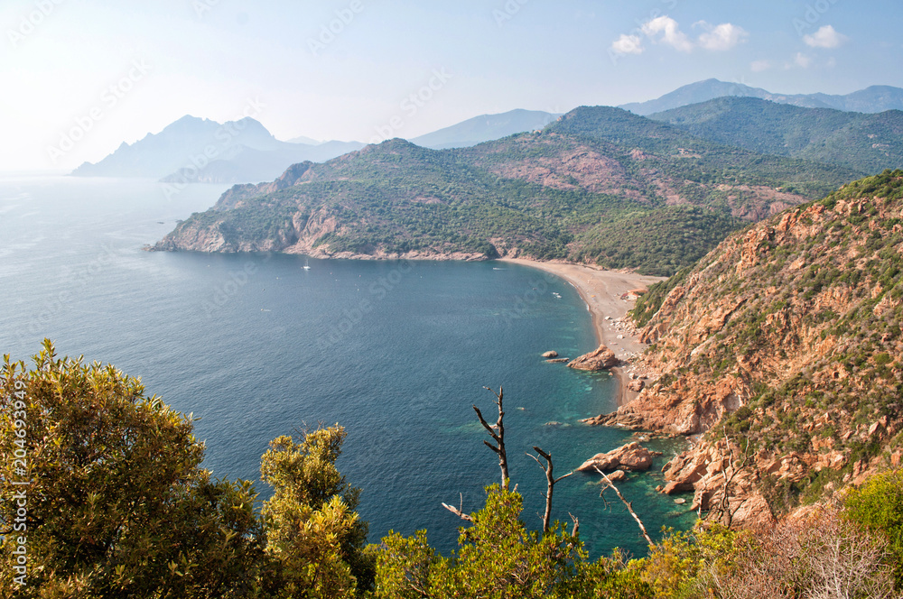 View of the clear sea and rocky hills in Corsica