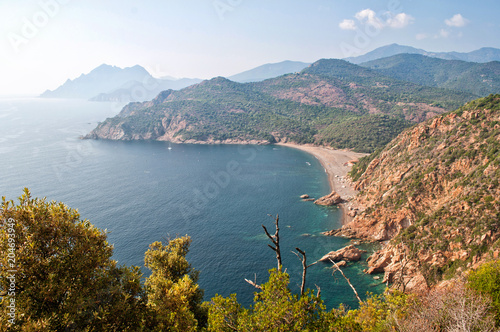 View of the clear sea and rocky hills in Corsica