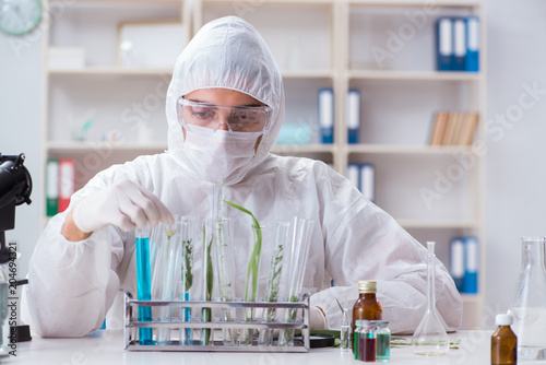 Biotechnology scientist chemist working in lab