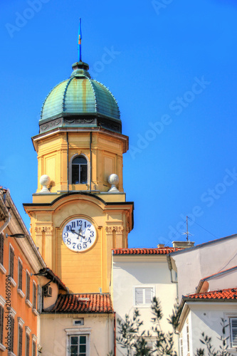 City clock tower Gradski toranj a Baroque landmark building of Croatian seaport town in sunny summer day against blue sky at main street Korzo of city, Rijeka Croatia Balkan peninsula Southeast Europe photo