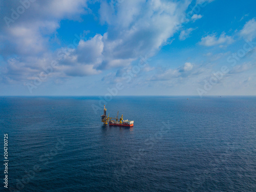Aerial View of Tender Drilling Oil Rig (Barge Oil Rig) in The Middle of The Ocean © bomboman