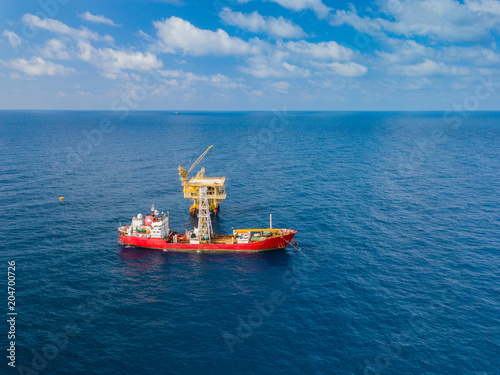 Soil Boring Boat (a geotechnical drilling cum analogue survey vessel) close to a oil platform