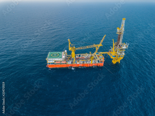 Aerial View of Tender Drilling Oil Rig (Barge Oil Rig) in The Middle of The Ocean photo