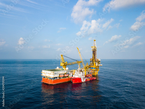 Aerial View of Tender Drilling Oil Rig (Barge Oil Rig) in The Middle of The Ocean photo