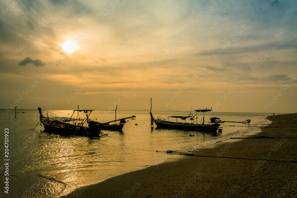 landscape of sunset with Small Fishing Boats in Thailand