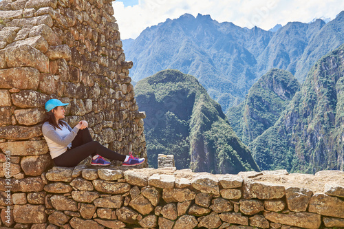 Woman sit in Machu Picchu