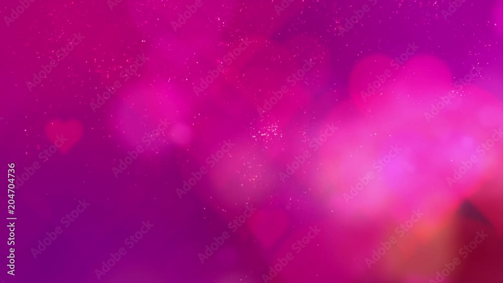 Flowing Valentine heart glittering particles in abstract de-focus background