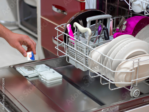 placing the dishwasher detergent for dirty dishes