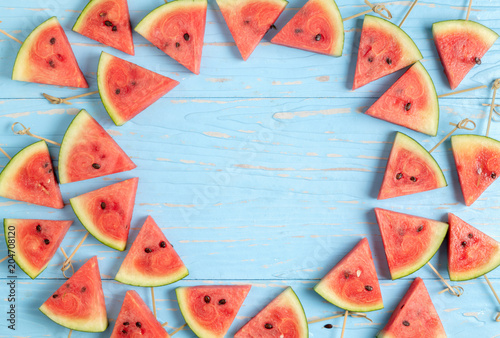 Watermelon slice on a blue rustic wood background, Summer concept