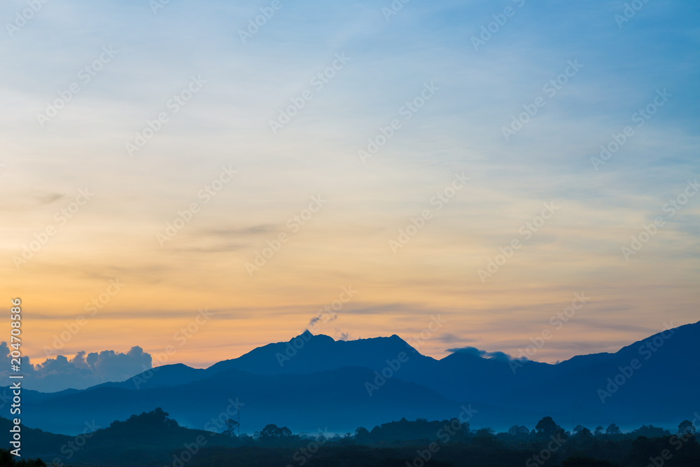 Silhouette mountain sunrise with colorful sky cloud