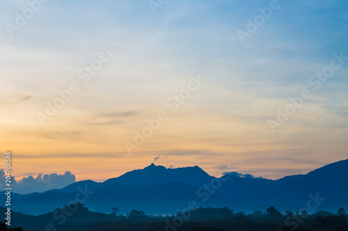 Silhouette mountain sunrise with colorful sky cloud