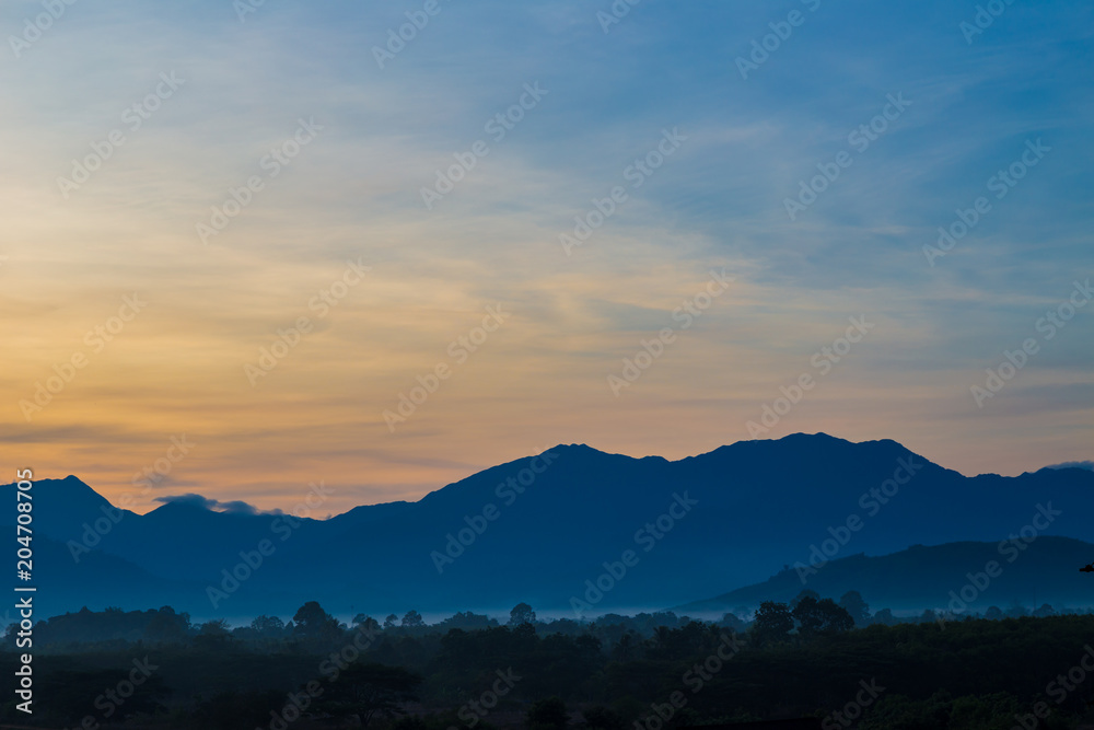 Silhouette mountain sunrise with colorful sky cloud