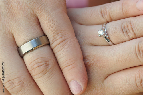Wedding rings on fingers