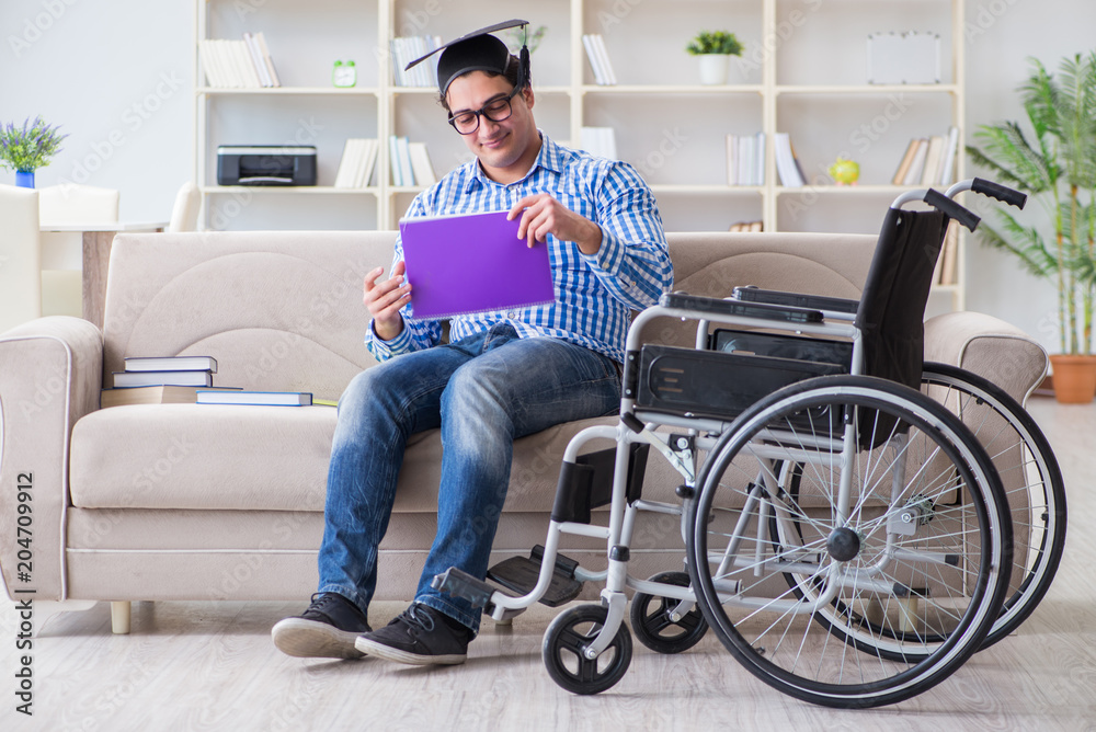 Young student on wheelchair in disability concept Young student on wheelchair in disability concept