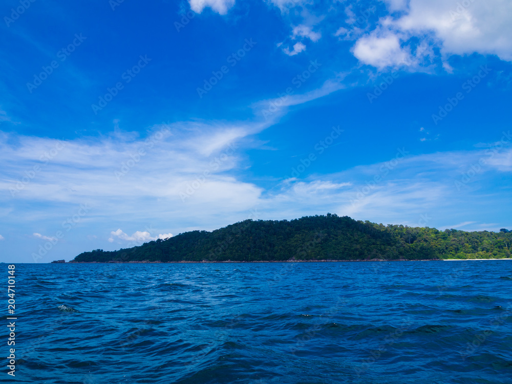 Tranquil blue sea with exotic island Andaman sea